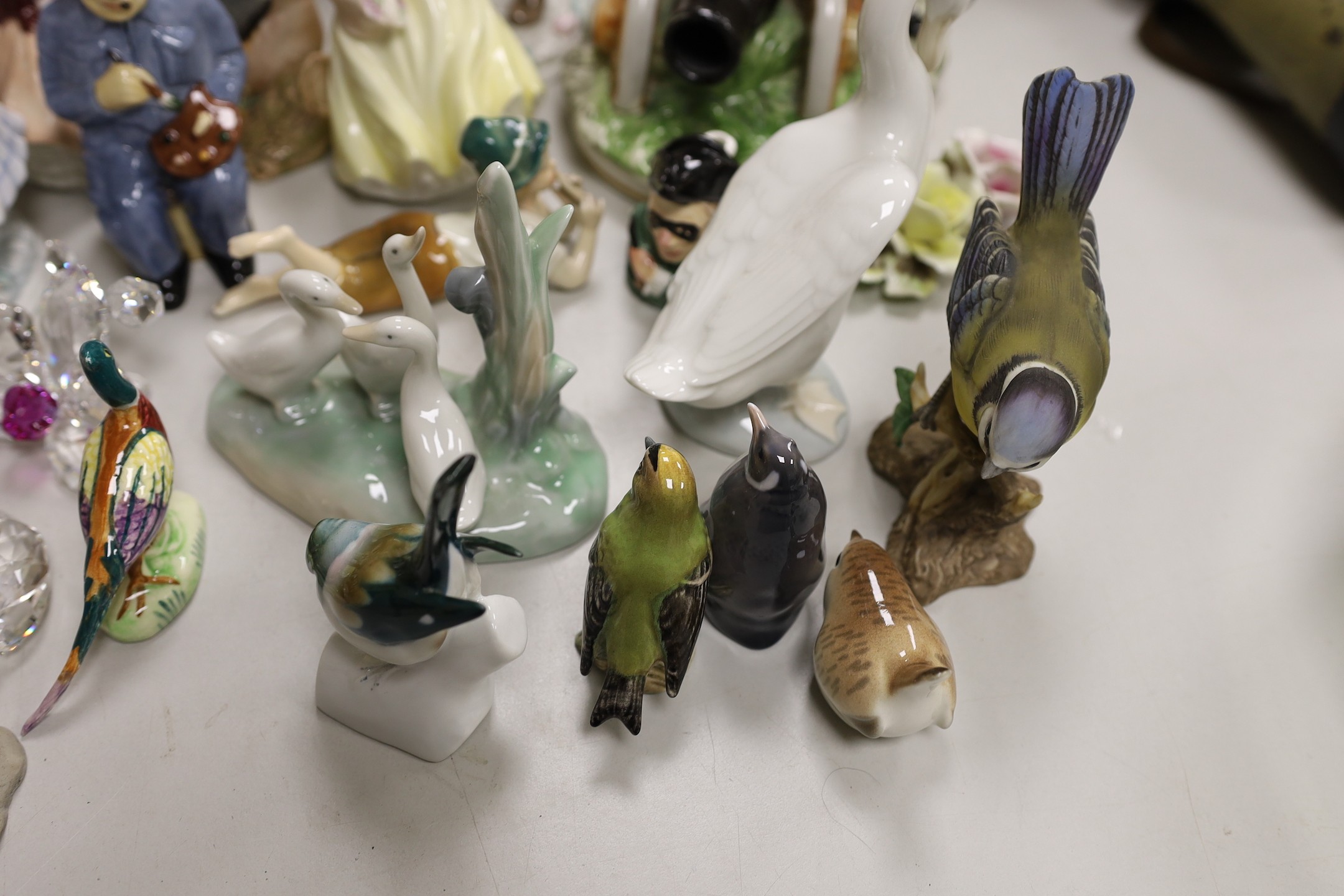 A Royal Copenhagen figure and a collection of Nao ducks, Beswick, Doulton and other birds